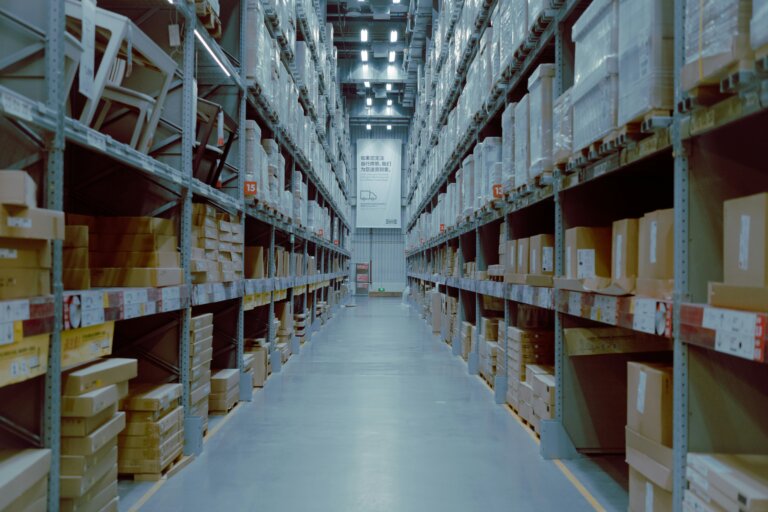 Long aisle of tall warehouse shelving